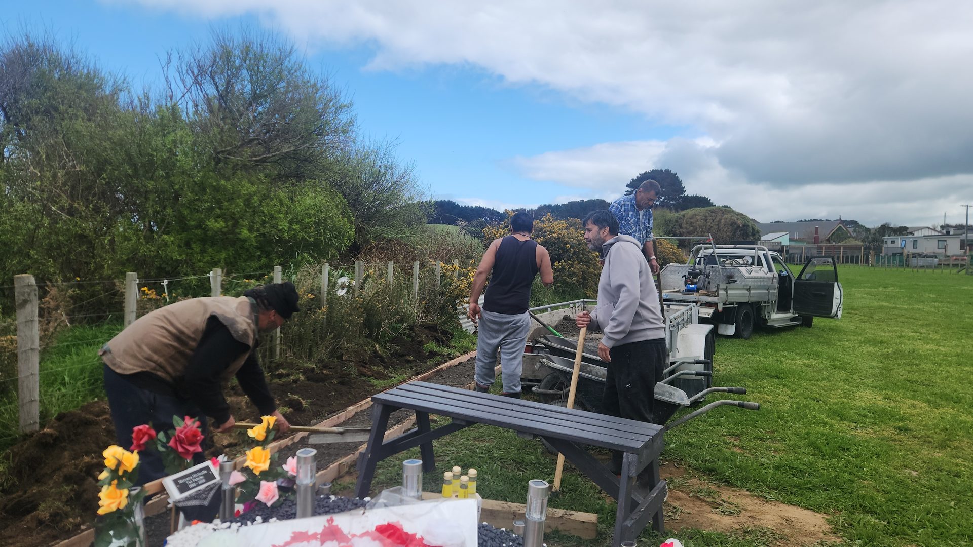 Whānau working together in the māra kai