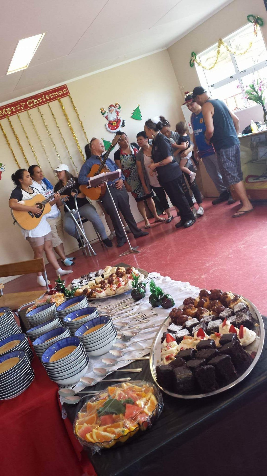 Whānau gathered for music and kai at the marae.
